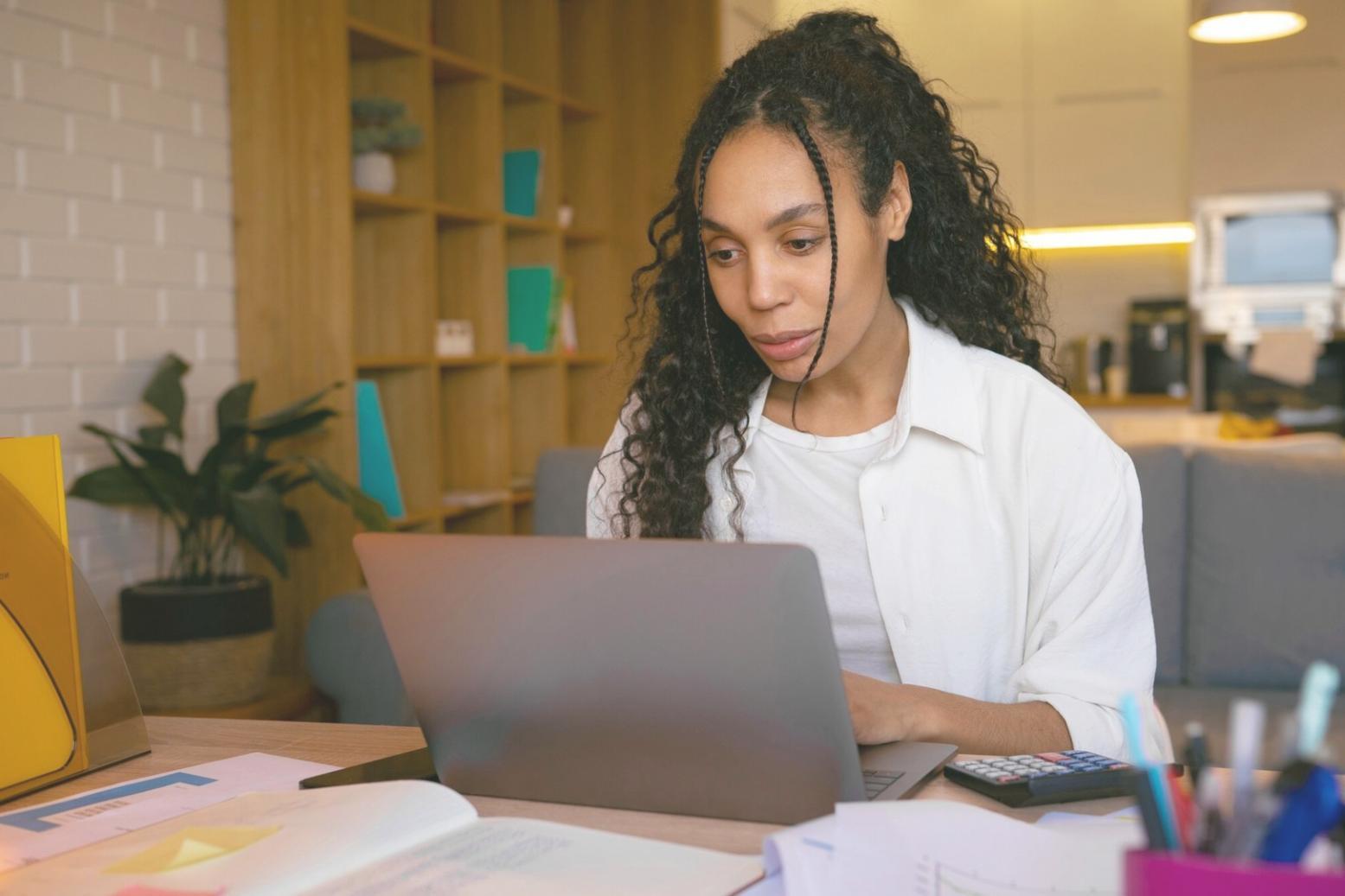 Entrepreneur planning business expenses and reviewing budget categories